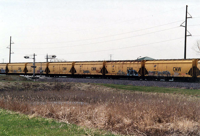 145.jpg - A string of C&NW hoppers are in the same train at 95th St., Kenosha.  May 2009.