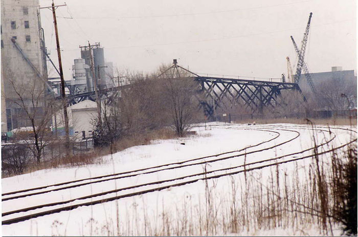 019.jpg.jpg - This March 2007 view shows the Kinnickinnic River Bridge in the open position on the old C&NW passenger main line - Milwaukee to Chicago.