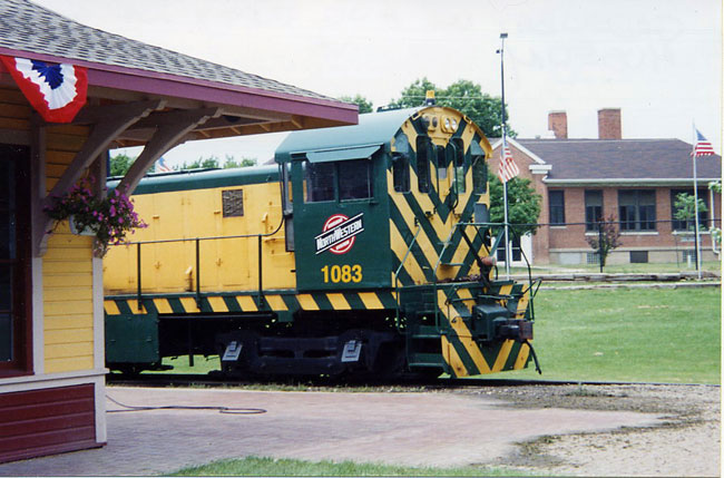 021.jpg.jpg - C&NW 1083, an Alco SW-1, at the National Railroad Museum, Green Bay, Wisconsin, August, 2004.  This isn't the original 1083 - that one went into Lake Michigan at Two Rivers, Wisconsin on March 7, 1958.  When the museum painted their SW-1 and the time came to select a number, a board member, who was a C&NW official, picked 1083 as an "inside joke."