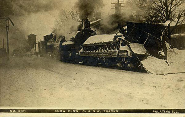 143.jpg - This one is really old - a snow plow rolling through Palatine, IL in the early 1900's.