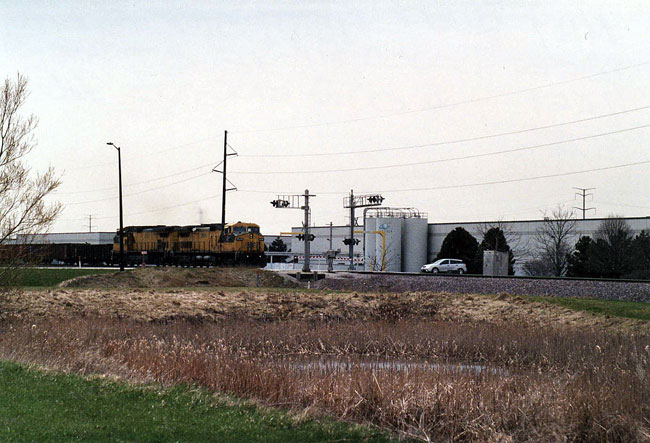 144.jpg - The last two C&NW locomotives - 8646 & 8701 - west bound on the New Line at 95th St., Kenosha.  May 2009
