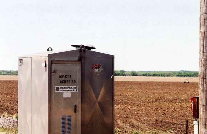 179.jpg - The C&NW lives on at Acker Road, 5 miles east of Clinton, IA.  They tried but couldn't obliterate it. (Top-right on the enclosure).  04/10