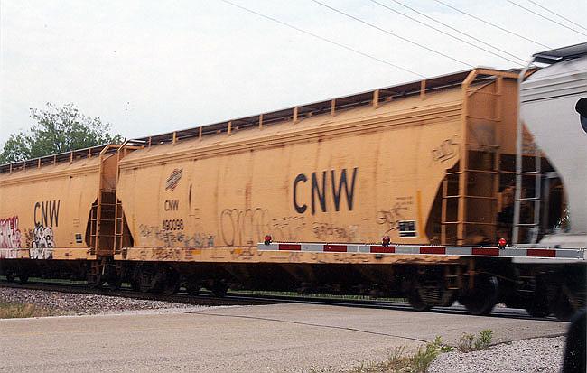 221.jpg - They are still with us!  Wally caught the C&NW covered hopper west of Kenosha on the New Line.