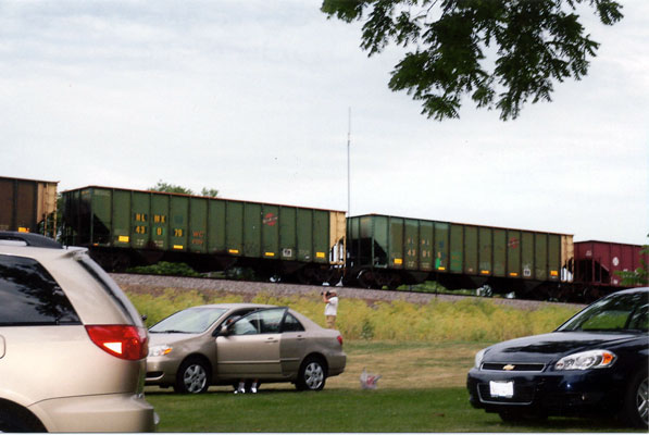224.jpg - The passing scene at the 2012 Galesburg Railroad days - 2 C&NW hopper cars.